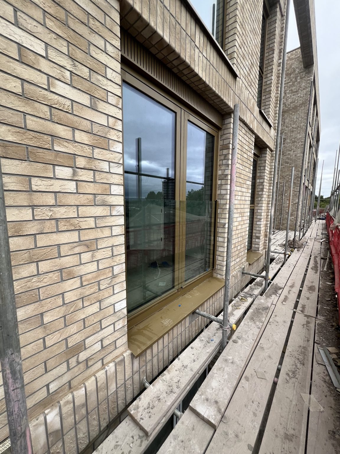 White-framed glazed doors installed in brickwork, photographed by Kingfisher